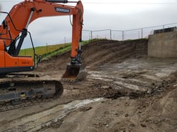Benched excavation reduced the need for trench boxes, even with deep excavations.
