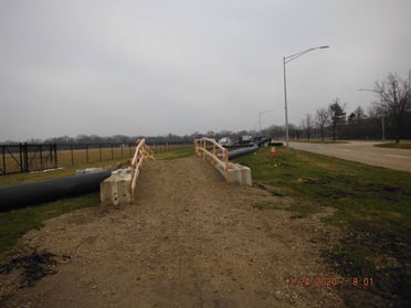 An earthworks crossing allowed trail users to safely navigate the bypass line near the fire station.