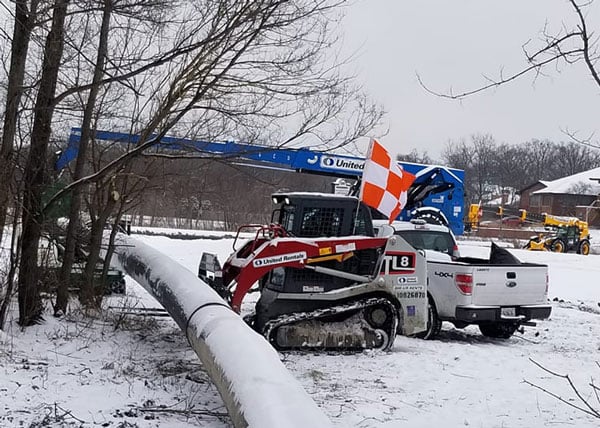 Even the humble skid-steer gets a flag near the airport